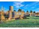 Community entrance featuring a brick sign with the 'Reunion' name and manicured landscaping at 10788 Ventura St, Commerce City, CO 80022