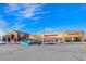 Commercial building featuring diverse retail and service spaces with ample parking at 10788 Ventura St, Commerce City, CO 80022
