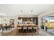 Open kitchen featuring stainless steel appliances, an island with seating, and natural light at 10788 Ventura St, Commerce City, CO 80022