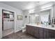 Modern bathroom with double vanity, walk-in shower, and large closet at 20 Wilcox St # 314, Castle Rock, CO 80104