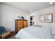 Bedroom with wood dresser and access to the kitchen at 20 Wilcox St # 314, Castle Rock, CO 80104