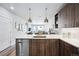 Open concept kitchen with island and stainless steel dishwasher at 20 Wilcox St # 314, Castle Rock, CO 80104