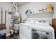 Laundry room with washer, dryer, and extra storage at 20 Wilcox St # 314, Castle Rock, CO 80104