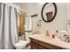 Functional bathroom with a shower-tub combo, vanity, and ample lighting at 1250 S Monaco Street Pkwy # 49, Denver, CO 80224
