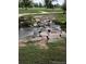 Scenic creek flowing through the community with rock features at 1250 S Monaco Street Pkwy # 49, Denver, CO 80224