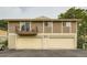 Building exterior view showing multiple garages, balcony, and siding at 1250 S Monaco Street Pkwy # 49, Denver, CO 80224