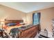 Comfortable main bedroom with a window and ample space for a queen-size bed and furnishings at 1250 S Monaco Street Pkwy # 49, Denver, CO 80224