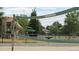 Garland Park features an outdoor volleyball court and playground at 1250 S Monaco Street Pkwy # 49, Denver, CO 80224
