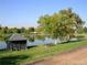 Picturesque pond with dock and picnic tables, providing recreational opportunities at 1250 S Monaco Street Pkwy # 49, Denver, CO 80224