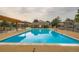 Community pool with lounge area, perfect for relaxation and recreation in a serene setting at 1250 S Monaco Street Pkwy # 49, Denver, CO 80224