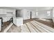Open-concept living space combining a kitchen with an island and a spacious living area at 9092 Telluride Ct, Commerce City, CO 80022