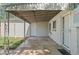 Cozy back patio with a metal awning and adjacent entry doors at 1177 Wabash St, Denver, CO 80220