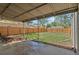 Covered patio overlooking spacious backyard with wooden fence surrounding the perimeter at 1177 Wabash St, Denver, CO 80220