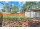 Spacious backyard is surrounded by a wooden fence and has a covered patio area at 1177 Wabash St, Denver, CO 80220