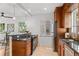 Kitchen featuring stainless steel appliances, breakfast bar with seating, and white walls at 1177 Wabash St, Denver, CO 80220