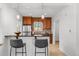 Modern kitchen features a breakfast bar and plenty of cabinets for storage at 1177 Wabash St, Denver, CO 80220