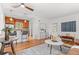 Bright living room features hardwood floors, bar seating and easy access to the kitchen at 1177 Wabash St, Denver, CO 80220