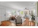 Bright living room features hardwood floors, neutral decor and comfortable seating arrangements at 1177 Wabash St, Denver, CO 80220