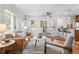 Bright living room features hardwood floors, bar seating and a ceiling fan at 1177 Wabash St, Denver, CO 80220