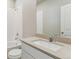 Well lit bathroom with white cabinets, sink, toilet, shower and bath at 48260 Shetland Dr, Bennett, CO 80102