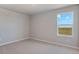 Bright bedroom with carpet, neutral walls and a large window with scenic view at 48260 Shetland Dr, Bennett, CO 80102