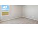 Bright bedroom with carpet, neutral walls and a large window with scenic view at 48260 Shetland Dr, Bennett, CO 80102