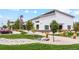 Modern community building featuring well-manicured landscaping, native grasses, and paved walkways at 48260 Shetland Dr, Bennett, CO 80102