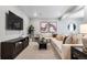 Inviting basement features a comfortable seating area, entertainment center, and stylish decor at 3444 Recess Pt, Castle Rock, CO 80108