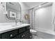 Stylish bathroom with modern vanity, decorative mirror, and tiled shower with bathtub combination at 3444 Recess Pt, Castle Rock, CO 80108