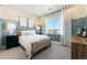 Cozy bedroom with a plush bed, neutral carpet, and large window offering natural light at 3444 Recess Pt, Castle Rock, CO 80108