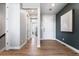 Inviting entryway boasting wood flooring, neutral walls, and a view into the home's interior at 3444 Recess Pt, Castle Rock, CO 80108
