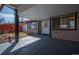 Cozy covered back patio perfect for outdoor entertaining with a view of backyard at 3360 Magnolia St, Denver, CO 80207