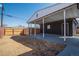 Large backyard featuring a patio, spacious dirt area, and a new fence at 3360 Magnolia St, Denver, CO 80207
