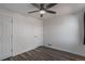 Bedroom featuring hardwood flooring, white walls, and two closets at 3360 Magnolia St, Denver, CO 80207