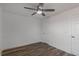 Bedroom featuring hardwood flooring, white walls, and a ceiling fan at 3360 Magnolia St, Denver, CO 80207