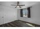 The bedroom has hardwood floors, a ceiling fan, and a window; it also has a closet for extra storage at 3360 Magnolia St, Denver, CO 80207