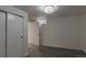 Neutral bedroom with plush carpet and sliding closet doors provides ample storage at 3360 Magnolia St, Denver, CO 80207