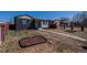 Landscaped front yard and neutral color palette with a concrete walkway leading to the front entrance at 3360 Magnolia St, Denver, CO 80207