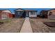 Charming single-story home with a walkway, neutral color palette, manicured front yard, and a welcoming entrance at 3360 Magnolia St, Denver, CO 80207