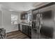 The kitchen features gray countertops, dark cabinets, and stainless steel appliances including a dishwasher at 3360 Magnolia St, Denver, CO 80207