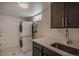 Convenient laundry room with stacked washer/dryer and ample storage at 3360 Magnolia St, Denver, CO 80207