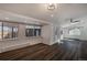 A spacious living room featuring recessed lighting, hardwood floors, and multiple windows at 3360 Magnolia St, Denver, CO 80207