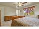 Spacious bedroom with wood dresser and large bed at 6618 S Newland Cir, Littleton, CO 80123