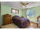 Cozy bedroom with a double bed, dresser and window at 6618 S Newland Cir, Littleton, CO 80123