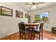 Dining area with hardwood floors and a table for four at 6618 S Newland Cir, Littleton, CO 80123