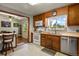 Kitchen boasts ample wood cabinetry and stainless steel appliances at 6618 S Newland Cir, Littleton, CO 80123