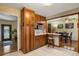 Kitchen with breakfast bar and view into dining area at 6618 S Newland Cir, Littleton, CO 80123