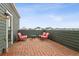 Inviting brick patio featuring outdoor seating and views of the neighborhood at 4138 N Quatar Ct, Aurora, CO 80019