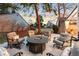 Backyard patio featuring an outdoor seating area with an inviting fire pit for outdoor enjoyment at 2867 S Oswego Ct, Aurora, CO 80014