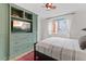 Comfortable bedroom features a large built-in unit and window with bright natural light at 2867 S Oswego Ct, Aurora, CO 80014